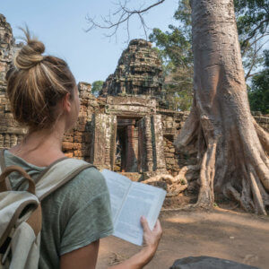 A student reading textbook outside the temple